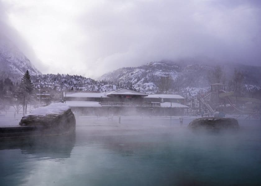 Steaming outdoor hot springs pool in Ouray, Co, with snowy mountains in the background. Steaming outdoor hot springs pool in Ouray, Co, with snowy mountains in the background.